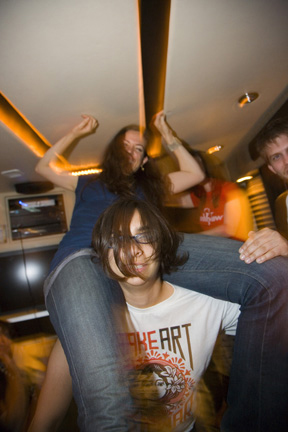 051-dance party of the year, on a bus going 60mph, Becky demonstrates true strength and balance-photo by Colin Young-Wolff