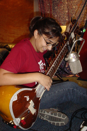 11. Becky sits down to lay down sitar on Somebody